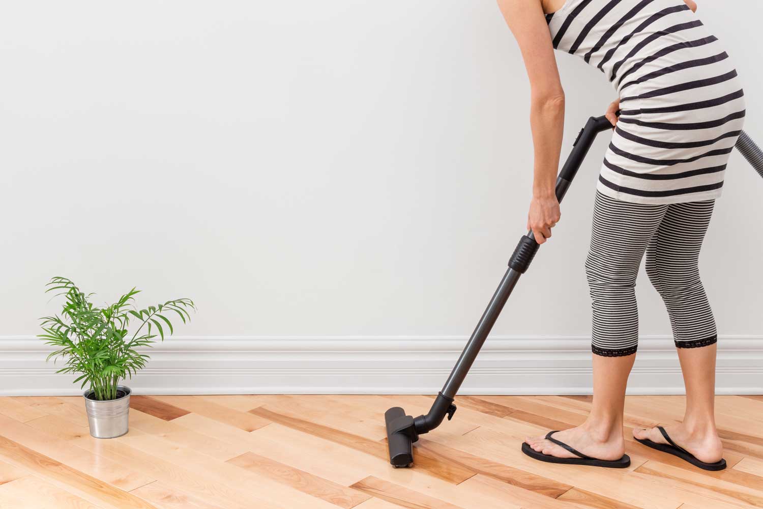 Regulary vacuum or sweep floors to remove dirt and keep your home floors looking amazing - tips from Footprints Floors in Roseville / Folsom.